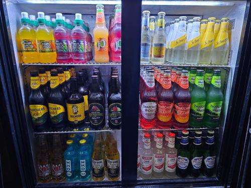 d'un réfrigérateur rempli de nombreux types de boissons. dans l'établissement The Wight Bay Hotel - Isle of Wight, à Sandown