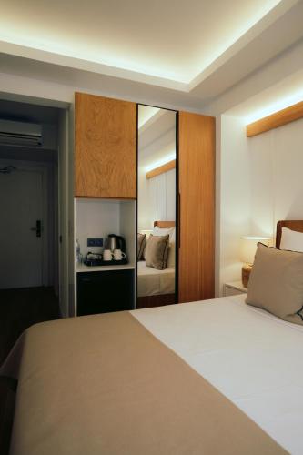 Ένα ή περισσότερα κρεβάτια σε δωμάτιο στο Skopea Inn Exclusive Hotel