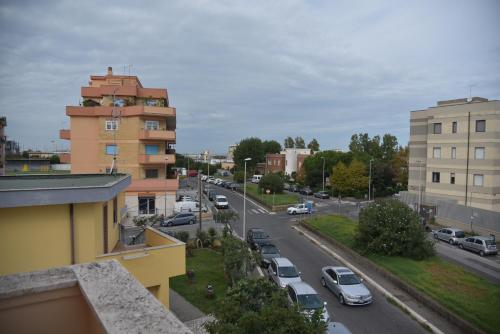 a view of a city with cars parked on a street at La Lira in Fiumicino