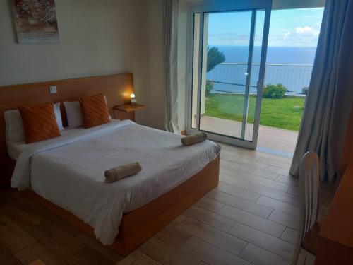 Ένα ή περισσότερα κρεβάτια σε δωμάτιο στο CASA SOL E VISTA 2