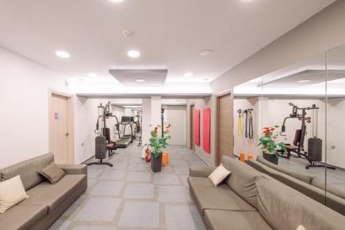 a living room with a couch and gym equipment at Medusa Apartments in Rethymno Town