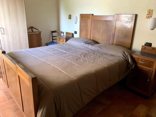 Postel nebo postele na pokoji v ubytování Colferraio 23 dove l'accoglienza è di casa!