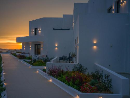 a white building with lights on the side of it at El Mar Naxos in Naxos Chora