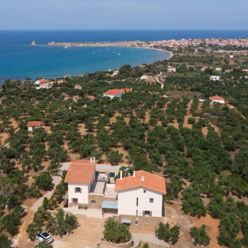an aerial view of a house with the ocean at Modone Villas in Peloponnese in Methoni