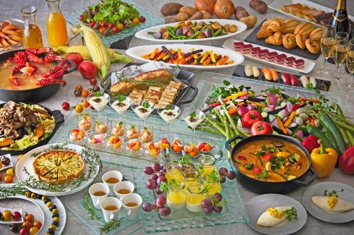 a table topped with lots of different types of food at Keio Plaza Hotel Sapporo in Sapporo