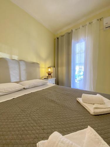 Katil atau katil-katil dalam bilik di Panos Apartment