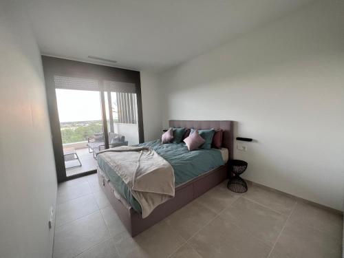 Ένα ή περισσότερα κρεβάτια σε δωμάτιο στο Casa Torwoods Las Colinas