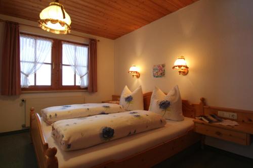 Ένα ή περισσότερα κρεβάτια σε δωμάτιο στο Landhaus Conny