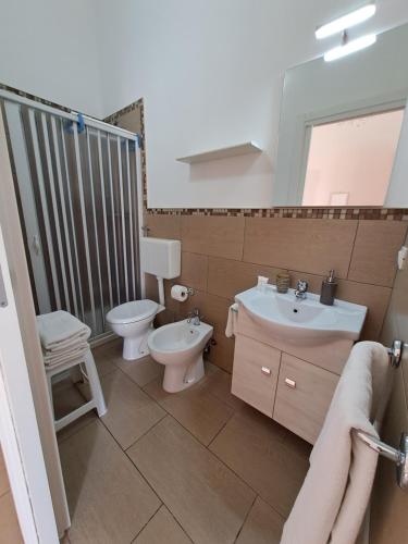 a bathroom with a toilet and a sink at B&B Fior di Mare in Porto Cesareo