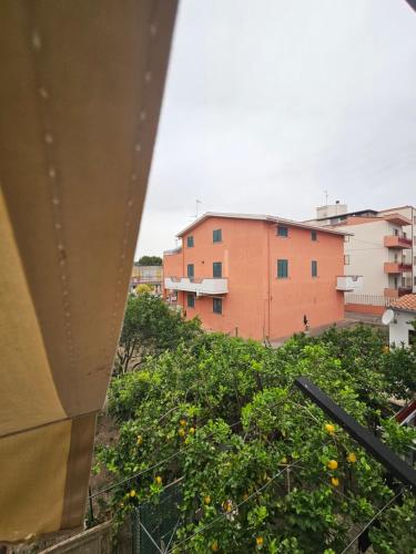 a view of a building with orange trees at La Casa nel Paesello in Portocannone