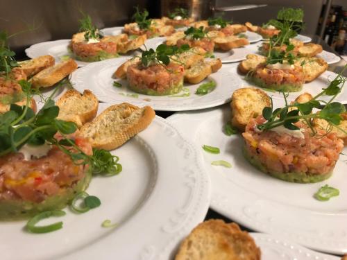 a bunch of plates of food on a table at Das Halali - dein kleines Hotel an der Zugspitze in Ehrwald