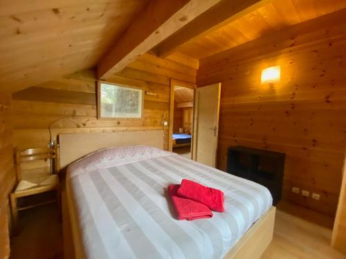 Ένα ή περισσότερα κρεβάτια σε δωμάτιο στο Chalet Serre-Chevalier