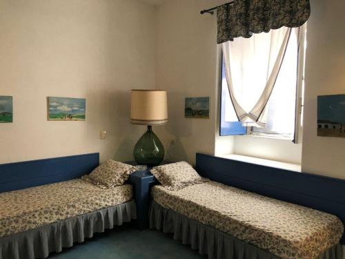 En eller flere senge i et værelse på il cancelletto