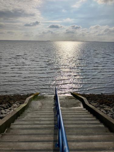 a set of stairs leading into the water at Nordpalais vor Sylt in Emmelsbüll-Horsbüll