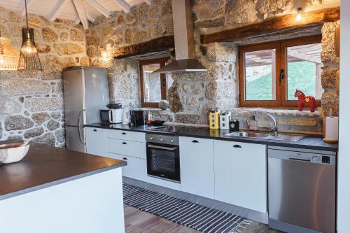 Kuchyň nebo kuchyňský kout v ubytování CASAS DA MORGADINHA - Casas de Férias e Turismo Rural