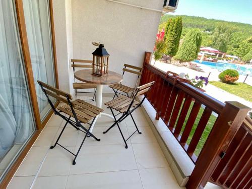 a balcony with a table and chairs and a view at Apartment Blue Lagoon in Rogachevo