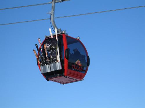 a ski lift with a bunch of skis on it at Hotel Ylläsrinne in Ylläsjärvi