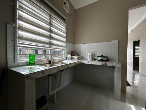 Kuchyň nebo kuchyňský kout v ubytování Rest Homestay