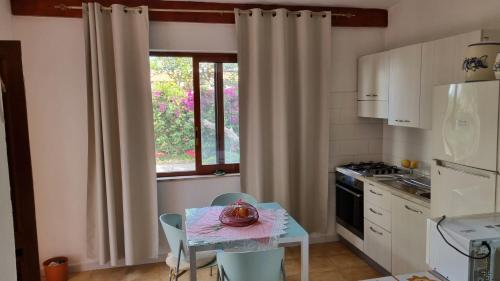 a kitchen with a table with a bowl on it at La Dracena in Ischia