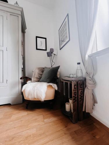 a bedroom with a bed and a wooden table with a table at Im alten Pastorat in Grevenbroich