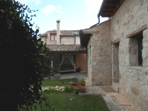 an outside view of a house with a yard at La Casona de Castilnovo - Gay Men Only in Valdesaz