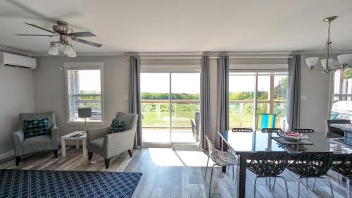 a living room with a table and chairs at Cape Breton Villas in Inverness