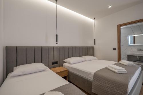 Ένα ή περισσότερα κρεβάτια σε δωμάτιο στο Keos Hotel
