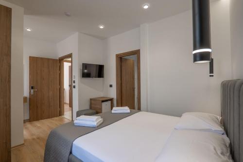 Ένα ή περισσότερα κρεβάτια σε δωμάτιο στο Keos Hotel