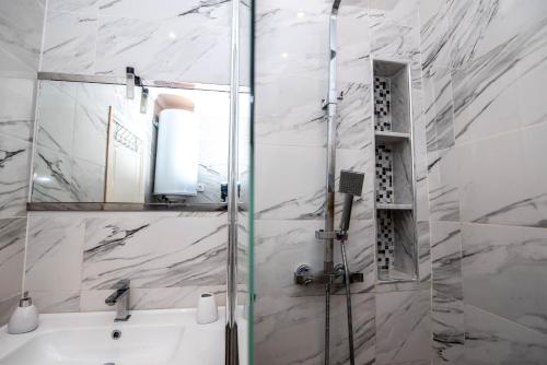 a bathroom with a shower and a sink at Private residence - Just like home in Agadir