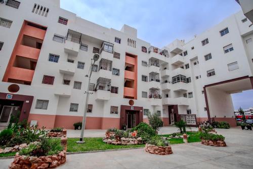a large white building with a lot of windows at Private residence - Just like home in Agadir