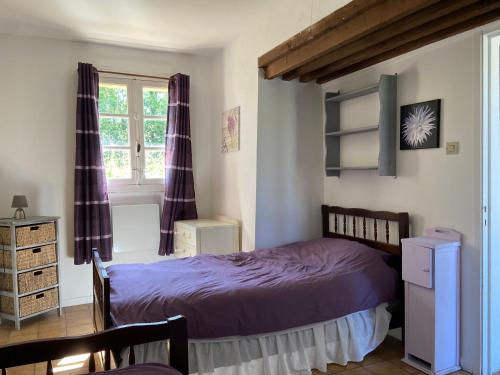 Postel nebo postele na pokoji v ubytování Lavender Cottage