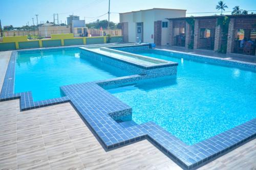 a large swimming pool with blue tiles on a building at The Residence Hotel Dodoma in Dodoma