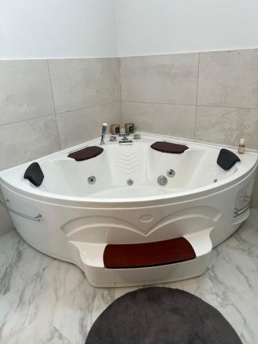 a white bath tub sitting in a bathroom at Eleutheria in Gravina di Catania