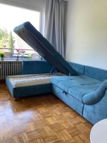 a couch with a slide on it in a living room at Waldglück in Wolfshagen