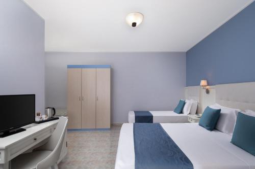 TV a/nebo společenská místnost v ubytování Hotel Rosa dei Venti