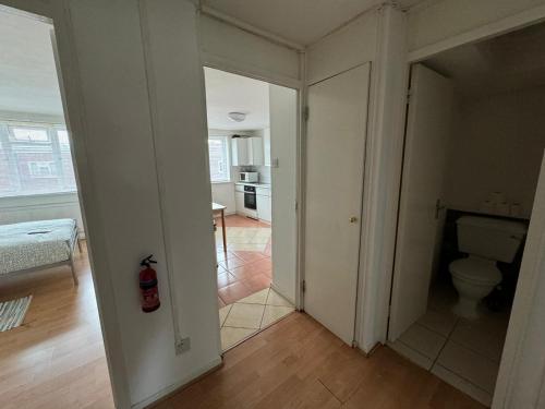an empty room with a toilet and a kitchen at PRP Pennack Road Peckham London in London
