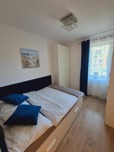 Posteľ alebo postele v izbe v ubytovaní Apartament Turkusowy Kołobrzeg Podczele