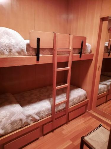 a couple of bunk beds in a room at Casa StePa in Pescasseroli