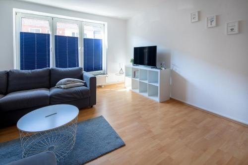 Televiisor ja/või meelelahutuskeskus majutusasutuses Ferienwohnung Liegeplatz