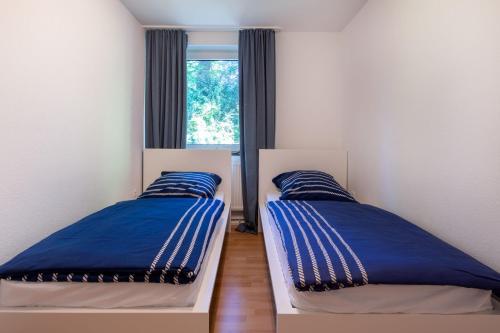 Voodi või voodid majutusasutuse Ferienwohnung Liegeplatz toas