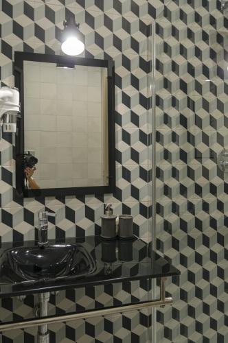 a bathroom with a sink and a mirror at B&B Sbarco dei 1000 Marsala in Marsala