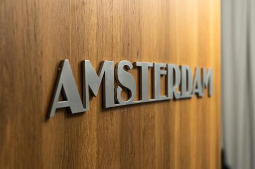 a sign on a door with the word anniversary at Elegant Apartments in Poznań