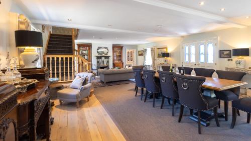 a living room with a table and chairs at Lissadell on The Beach in Lissadell