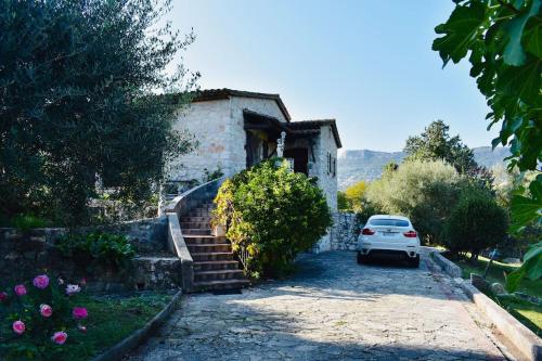 a white car parked in front of a house at Villa Azur Star, Vence, French Riviera in Vence