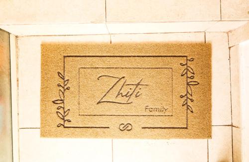 a drawing of a life family on a tile floor at Vila Zhiti in Durrës