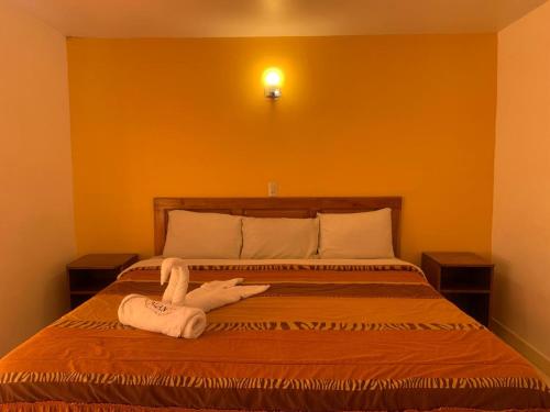 Una cama o camas en una habitación de Hotel y Cabañas Alan