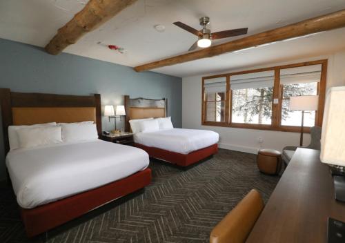 a hotel room with two beds and a window at The Lodge at Breckenridge in Breckenridge
