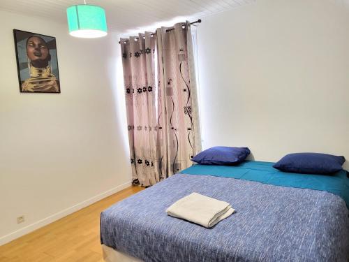 Ένα ή περισσότερα κρεβάτια σε δωμάτιο στο Vacance à 5 minutes de Genève