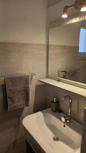 a bathroom with a sink and a mirror at Apartment Inter Vivos in Smokvica