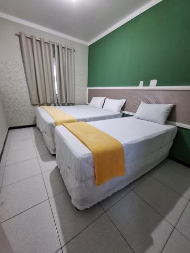 Katil atau katil-katil dalam bilik di Suites Hipolitus